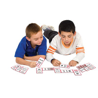 two boys playing Junior Learning JL404 factor dominoes