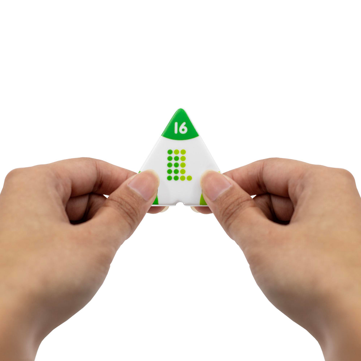 Triangular dice with number 16 held between two hands on a white background
