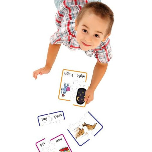 boy playing with Junior Learning JL245 Preposition Puzzles 