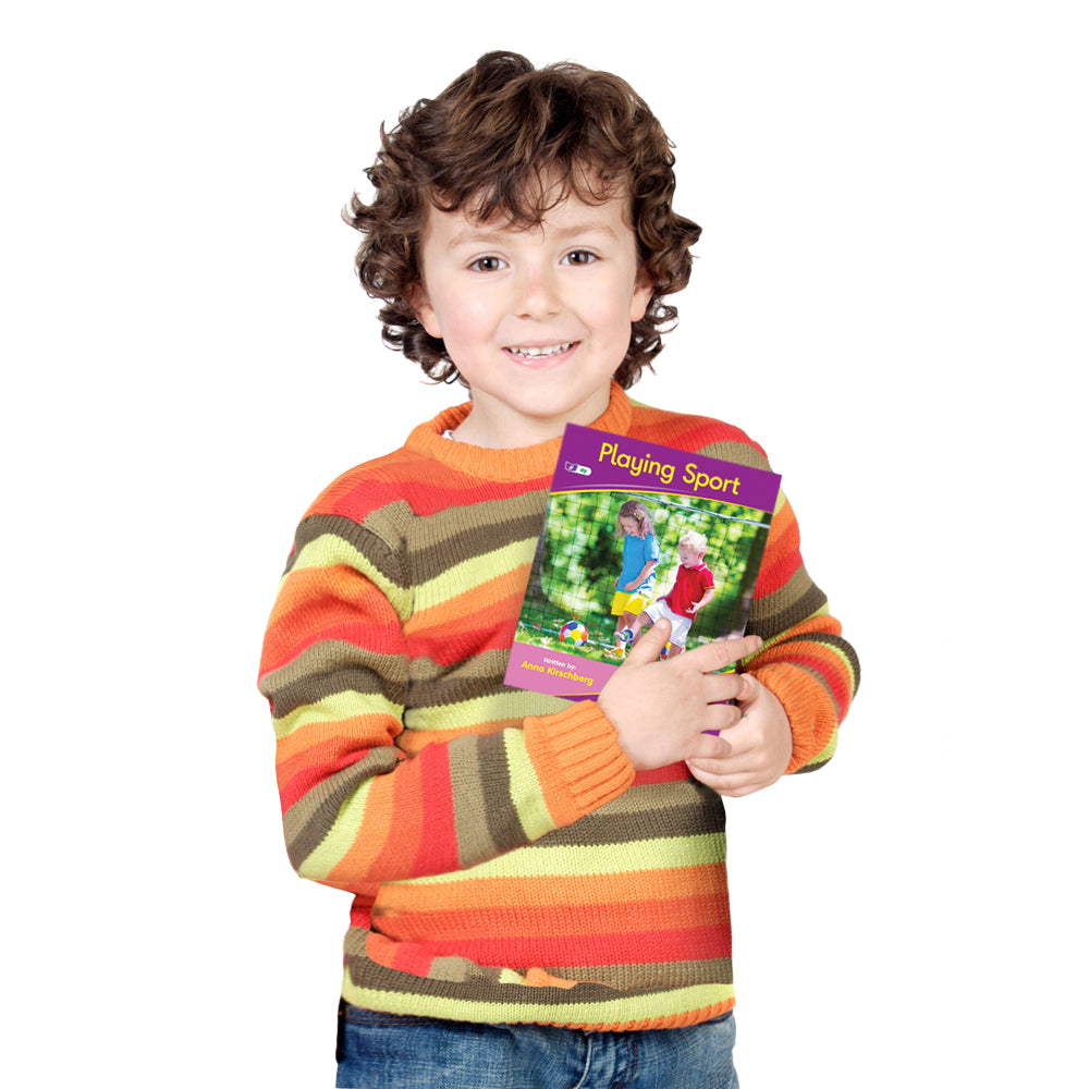 boy holding Junior Learning JL963 Letters and Sounds Phase 5 Set 1 Fiction - 6 Pack